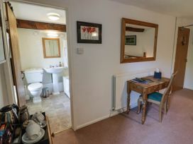 A bathroom with a toilet and sink at Ty Mawr Country House in Carmarthen