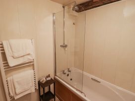 A bathroom with a bathtub and shower at Ty Mawr Country House in Carmarthen