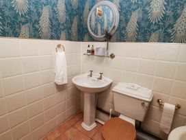 A bathroom with a sink and toilet at Ty Mawr Country House in Carmarthen