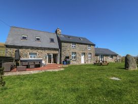 A house with patio furniture and garden at Cefnbron in Caernarfon