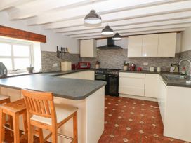 A kitchen with countertops and appliances at Cefnbron in Caernarfon