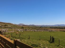 A view of fields and mountains at Cefnbron in Caernarfon