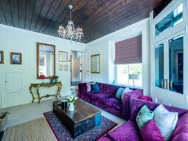 A living room with a coffee table and two sofas at Gwynfryn House in Llanbedr