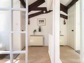 A hallway with a plant and picture frame at Cnicht View in Porthmadog