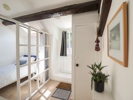 A bedroom with a bed and a door at Cnicht View in Porthmadog