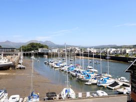 A marina with boats in water at Cnicht View in Porthmadog