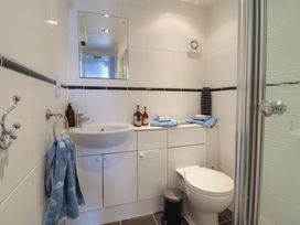 A bathroom with a sink and shower at Cnicht View in Porthmadog