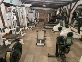 A gym with various exercise equipment at Number 19 Ferryside