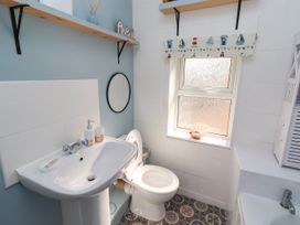 A bathroom with a sink and toilet at The Old Bank House near Amble