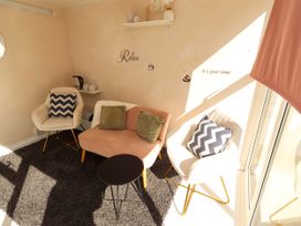 A snug area with sofa and chairs at The Old Bank House Red Row near Amble