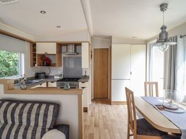 A kitchen with a dining area at Plot 13A