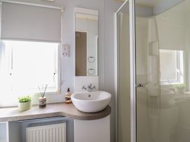 A bathroom with a sink and shower at Plot 13A
