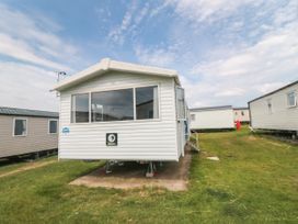 A caravan in an outdoor area at 42 Oak Green