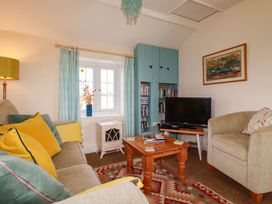 A living room with a sofa and television at The Granary 