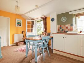 A kitchen with a table and chairs at The Granary
