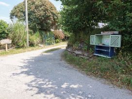 A pathway with a sign and a storage unit for sale at The Granary in 