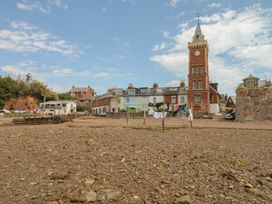 A view of buildings and a clock tower at Tower View Cottage in Lympstone