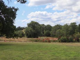 A landscape with grass and trees at Tower View Cottage in Lympstone