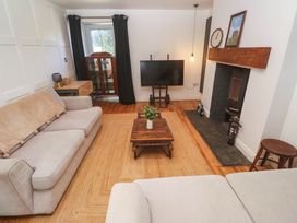 A living room with a sofa and television at The Lookout in Redruth