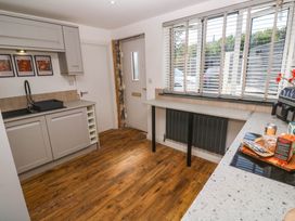 A kitchen with a sink and cabinets at The Lookout in Redruth