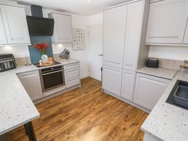 A kitchen with modern appliances and a countertop at The Lookout in Redruth