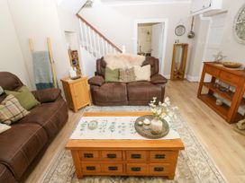 A living room with a coffee table and sofa at St.Twynells Farm Pembroke