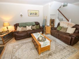 A living room with sofas and a coffee table at St.Twynells Farm in Pembroke