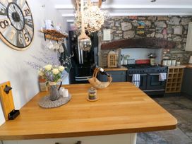 A kitchen with a countertop and kitchen appliances at St.Twynells Farm in Pembroke