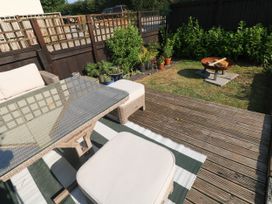 A garden with a table and chairs at St.Twynells Farm Pembroke