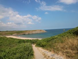 A beach view with hills and path at St.Twynells Farm in Pembroke