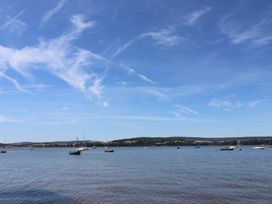 A view of water with boats and hills at Beech Walk 3 Sandy Bay, Exmouth