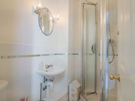 A bathroom with a sink and shower at 2 St. Michaels House in Lyme Regis