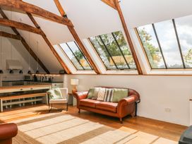 A living room with a sofa and coffee table at The Hayloft at Manaton