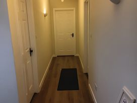 A hallway with doors and a floor mat at Sliabh League Mountain Lodge TEILEANN near Kilcar, County Donegal