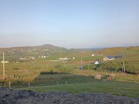 A scenic view of houses and fields at Sliabh League Mountain Lodge in TEILEANN near Kilcar, County Donegal