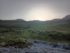 A view of mountains and a pathway in the grassland at Sliabh League Mountain Lodge TEILEANN near Kilcar, County Donegal