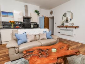 A living room with a sofa and coffee table at Flat 1 in Whitby