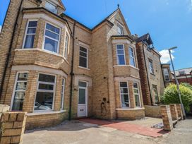 An exterior view of a building with windows and a door at Lansdowne Grange in Bridlington