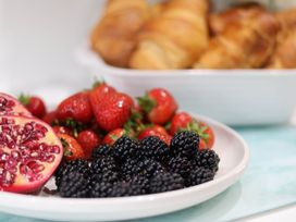 A plate with blackberries, strawberries, and pomegranate at Lansdowne Grange in Bridlington