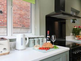 A kitchen with a kettle and a toaster on the counter at Lansdowne Grange in Bridlington