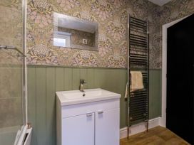 A bathroom with a sink and towel rail at Lansdowne Grange in Bridlington