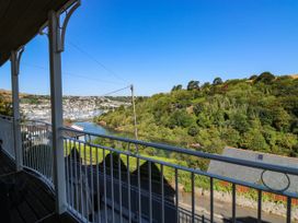 A view from a balcony overlooking a river and trees at 2 Inglewood Apartments in Dartmouth