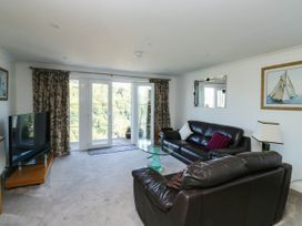 A living room with sofas and a television at 2 Inglewood Apartments in Dartmouth