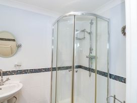 A bathroom with a shower and sink at 2 Inglewood Apartments in Dartmouth