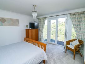 A bedroom with a bed and television at 2 Inglewood Apartments in Dartmouth