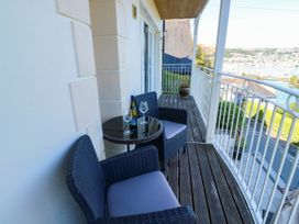 A balcony with chairs and a table at 2 Inglewood Apartments in Dartmouth