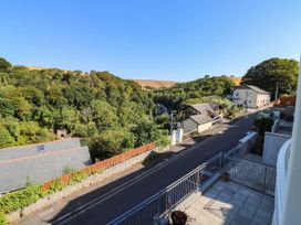 A view of houses and trees from a balcony at 2 Inglewood Apartments in Dartmouth