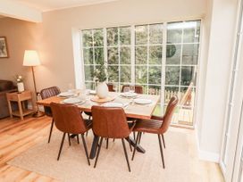 A dining room with a table set for dinner at Hedley Dene Cottage in Longhorsley