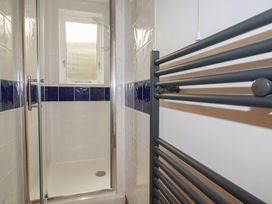 A shower area with a window at Newseal House 
