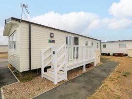A holiday home with stairs and windows at Haven Seashore, Ellerton Willerby Xtra in Great Yarmouth